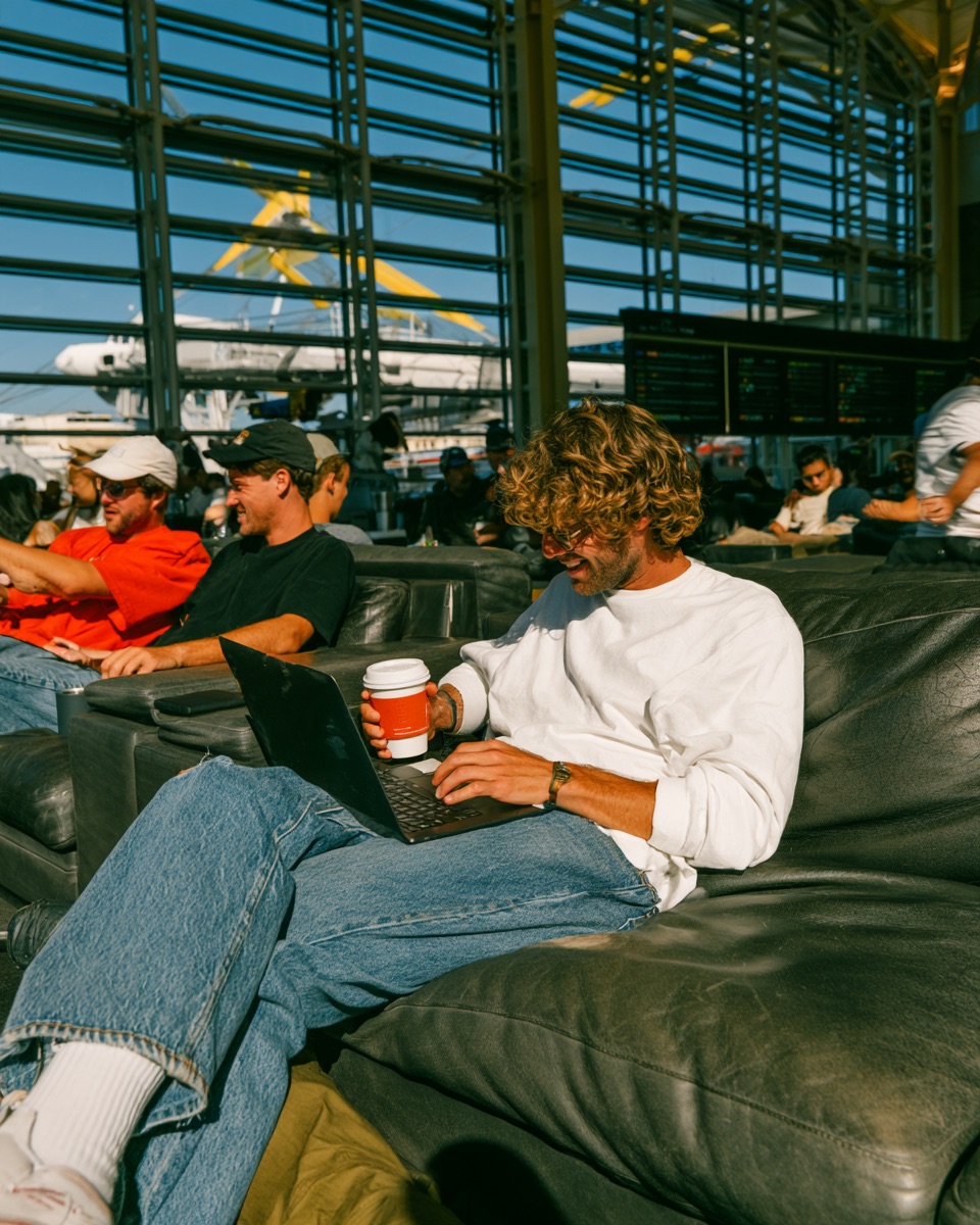 A leader working from an airport lounge
